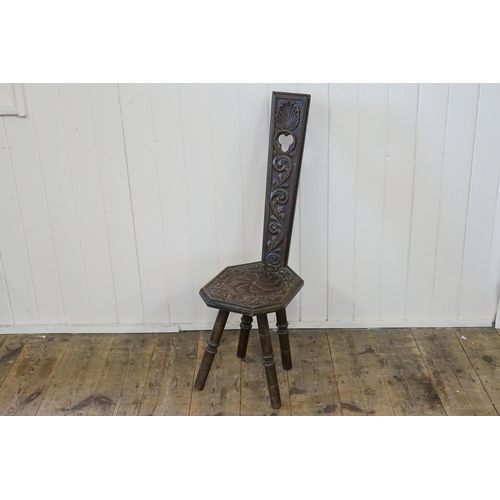 640 - An Arts & Crafts Carved Oak Sewing Chair with a pierced back.