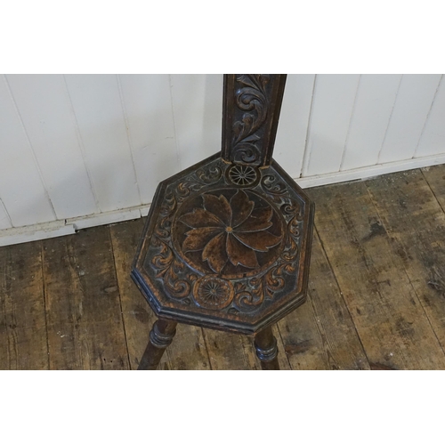 640 - An Arts & Crafts Carved Oak Sewing Chair with a pierced back.