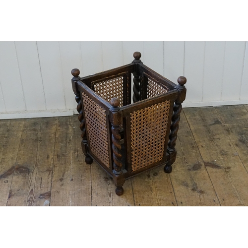 648 - A 1920s Oak Barley Twist & Bergere panelled Waste Paper Bin.