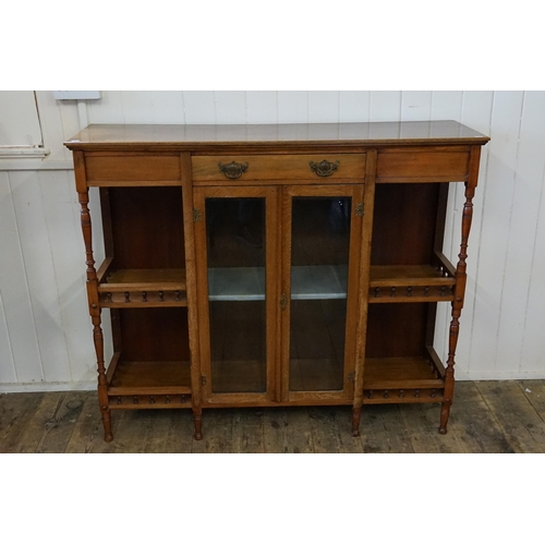 651 - A Late Victorian Drawing Room Sideboard fitted with a central Drawers, Two Glass Doors, Turned wood ... 