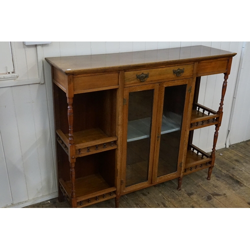 651 - A Late Victorian Drawing Room Sideboard fitted with a central Drawers, Two Glass Doors, Turned wood ... 