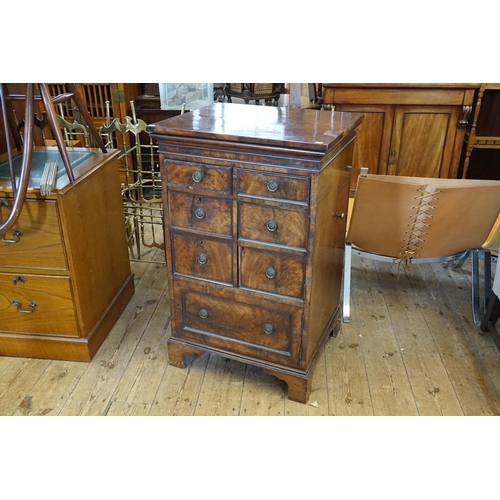 654 - A Georgian design Flame Figured Mahogany Rent Chest of Cupboard, Side Drawers & a Lift Up Top. Measu... 