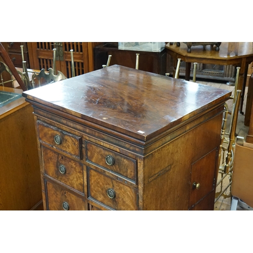 654 - A Georgian design Flame Figured Mahogany Rent Chest of Cupboard, Side Drawers & a Lift Up Top. Measu... 