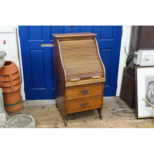 655 - A Tambour Roll Top Desk fitted with two drawers & an Open Work interior. Measuring: 60cms across x 6... 