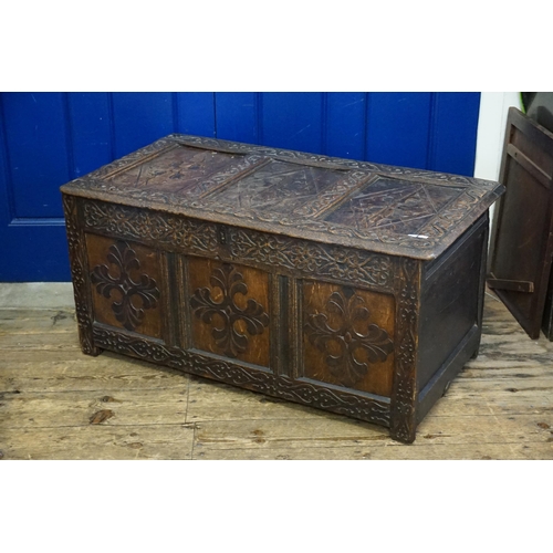 632 - An Antique Three Panelled Coffer with carved decoration. Measuring: 107cms across x 56cms deep x 52c... 