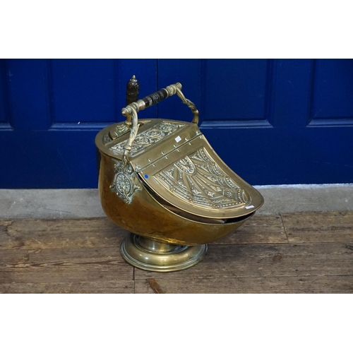 962 - A French Embossed Brass Helmet Coal Scuttle with Shovel.