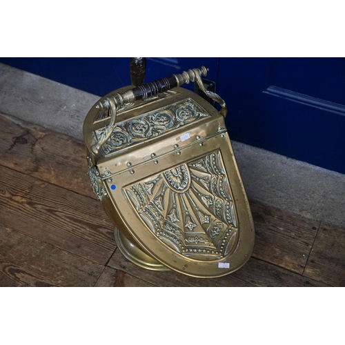 962 - A French Embossed Brass Helmet Coal Scuttle with Shovel.