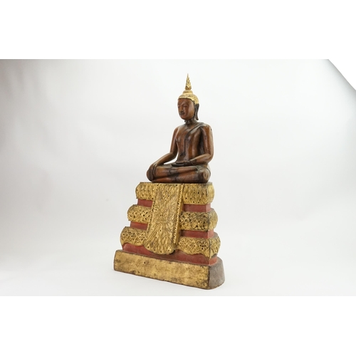 416 - An Asian Carved Wooden Seated Buddha in Wood with Gilt Highlights seated in the Lotus Position on a ... 