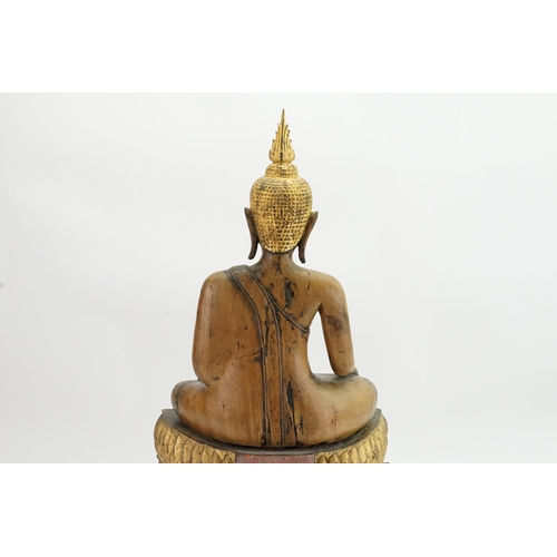 416 - An Asian Carved Wooden Seated Buddha in Wood with Gilt Highlights seated in the Lotus Position on a ... 