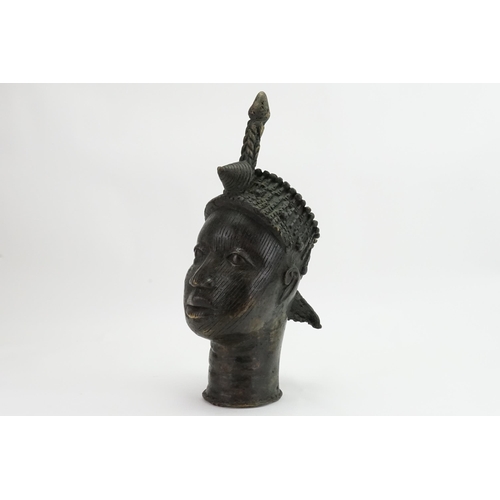 993 - A Benin Bronze Study of a Warrior with coiled & Rope Work Pattern head dress. Standing: 48cms.