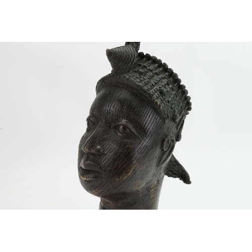 993 - A Benin Bronze Study of a Warrior with coiled & Rope Work Pattern head dress. Standing: 48cms.