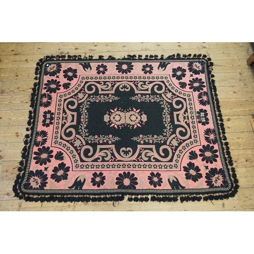 733 - A Belgian made Floral decorated Black & Pink Ground Rug with a fringed edge. Measuring: 175cms x 137... 