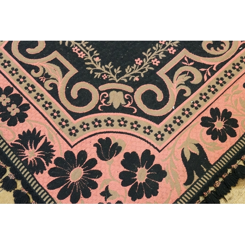 733 - A Belgian made Floral decorated Black & Pink Ground Rug with a fringed edge. Measuring: 175cms x 137... 