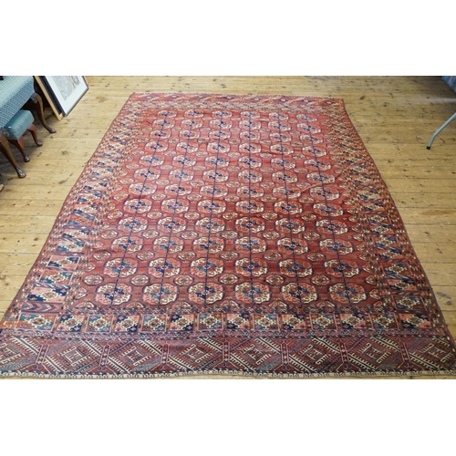 735 - An All Over Rust, Blue & Cream Multi Gold Pattern in a Trellis Work design Rug with long bordered en... 