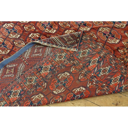 735 - An All Over Rust, Blue & Cream Multi Gold Pattern in a Trellis Work design Rug with long bordered en... 