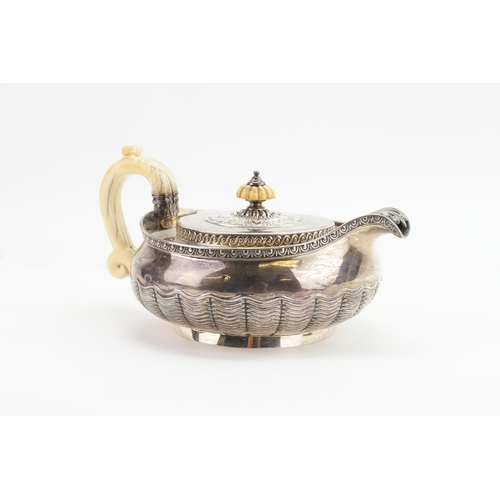 98 - An 1812 Classical design Squat Pattern Georgian Silver Tea Pot decorated with Egg & Rib Decoration, ... 