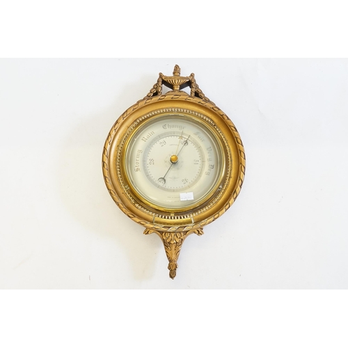 987 - A Compensated Barometer contained in a Circular Adams design Gilt Wood Frame with a fixed Brass labe... 