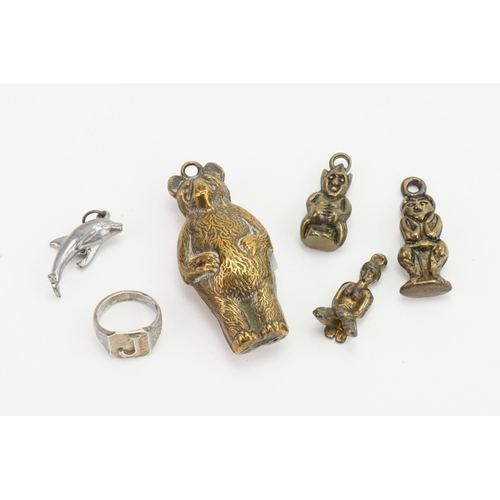 974 - A Stamped Brass Child's Rattle designed as a Bear, Ring marked 