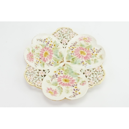 1095 - A Zsolnay (Hungarian Pottery) floral & pierced decorated plate. Measuring: 29cms.