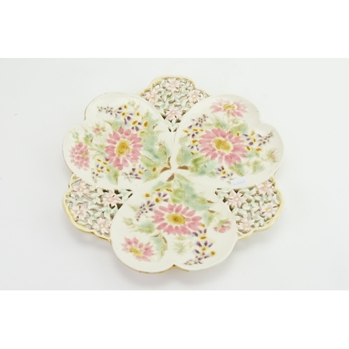 1095 - A Zsolnay (Hungarian Pottery) floral & pierced decorated plate. Measuring: 29cms.