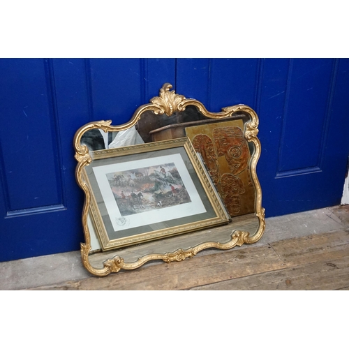 727 - A Gilt Framed Wall Mirror of Rococo Form. Measuring: 74cms x 70cms.