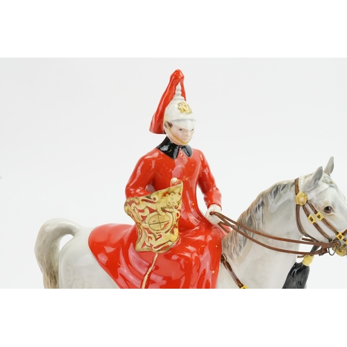 1054 - A Beswick Lifeguard Solider seated on his dappled grey horse, model no. 1624.