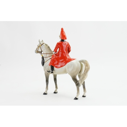 1054 - A Beswick Lifeguard Solider seated on his dappled grey horse, model no. 1624.