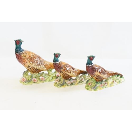 1061 - Three various Beswick Studies of Pheasants on flower encrusted Bases. Model No: 1225/1226 x2. Patent... 