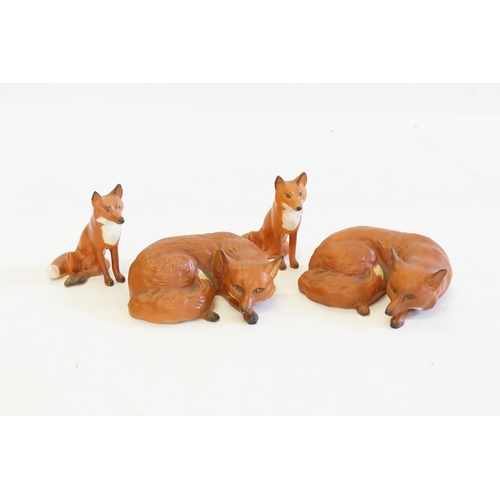 1085 - Four Various Beswick Studies of Foxes in a Tan Finish.