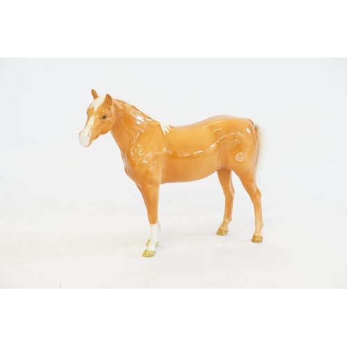 1050 - A Beswick Study of a Tan Horse with a White Mane, Front White Socks & a White Tale.