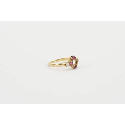 183 - A 9ct Opal and ruby set ring, set with 4 Ruby, 4 Opal and two diamonds. Weight 2g. Size Q.