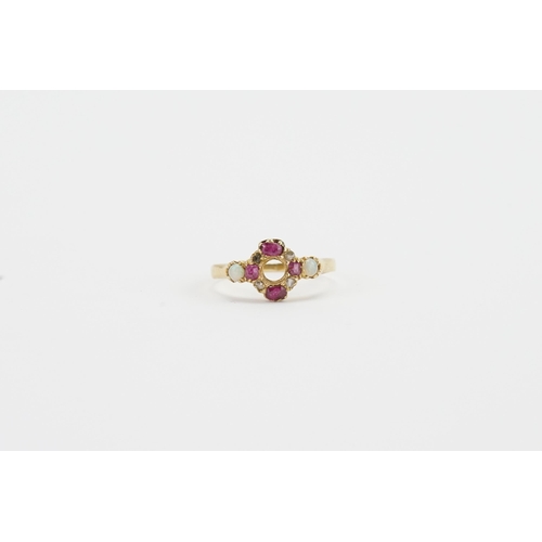 183 - A 9ct Opal and ruby set ring, set with 4 Ruby, 4 Opal and two diamonds. Weight 2g. Size Q.