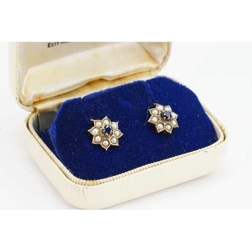 185 - A pair of 9ct Gold Sapphire and pearl set earrings. Screw backs. Weight 3g.