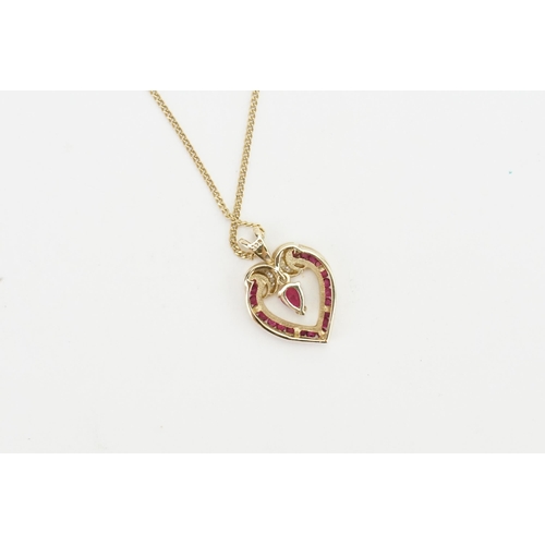 189 - A 9ct Gold Ruby set heart pendant, hung on a 9ct Gold chain. Weight 3.4g.