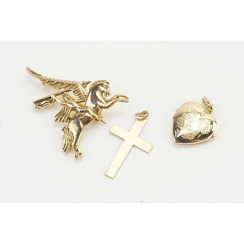 194 - A 9ct Gold pegasus brooch, 9ct Gold cross, and a 9ct gold heart locket.