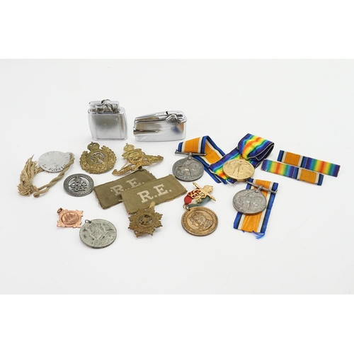 745 - A collection of medals and brooches, to include 1914-1918 medal x2, Victory medal, Coronation medals... 