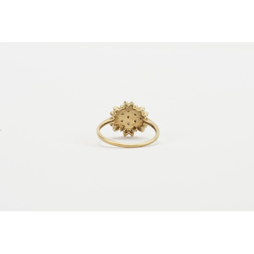 145 - A floral design 9ct gold diamond set ring. Weight 3g. Size T.