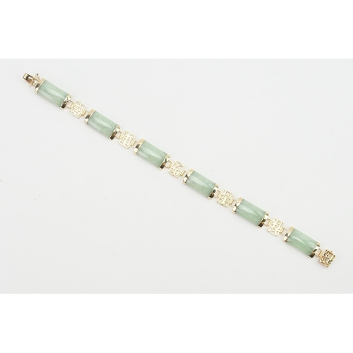 164 - A 9ct gold Jade set Chinese bracelet. Weight 12g.