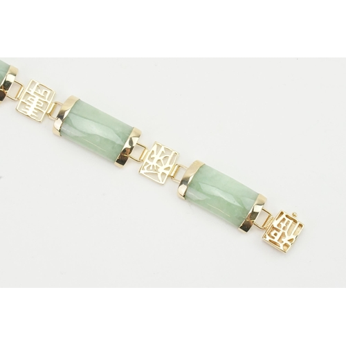 164 - A 9ct gold Jade set Chinese bracelet. Weight 12g.