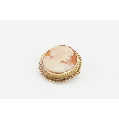 165 - A 9ct gold cameo brooch, depicting a lady looking to her left. Weight 11g.