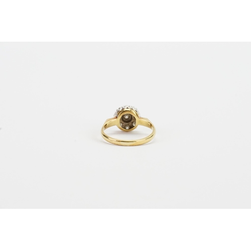 166 - A 18ct yellow gold diamond set ring, in the floral formation. Set with 11 diamonds. Centre stone app... 