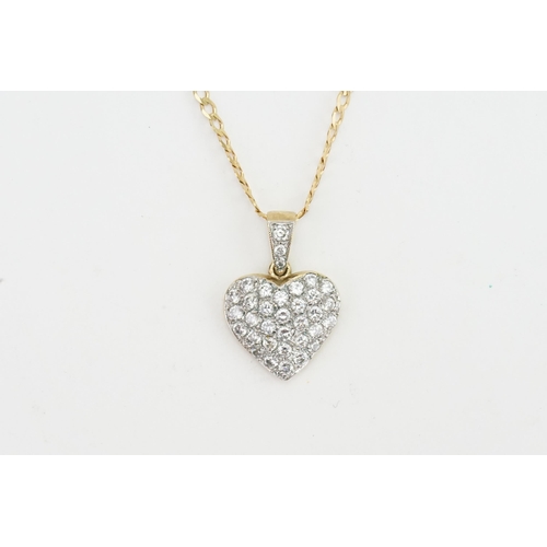 167 - A 9ct gold love heart pendant with paste stones, hung on a 9ct chain. Weight 8g.