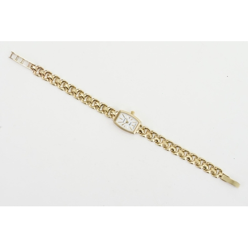 363 - A 9ct gold strap and case ladies watch. Weight total 15.5g.