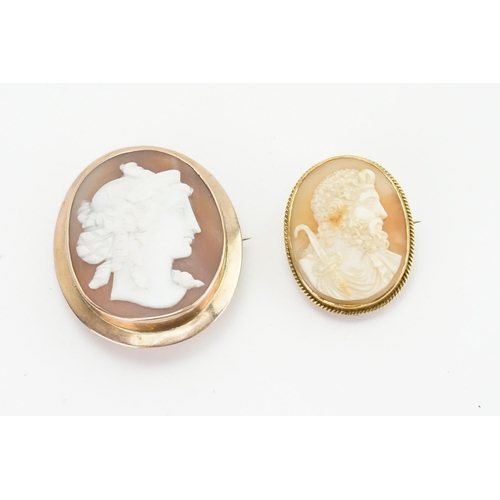 243 - Two gold  coloured cameos depicting a gentleman and a women looking to the right. Weight 15.8g.