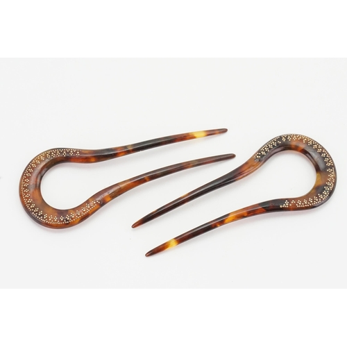 247 - A pair of Victorian tortoise shell hair pins, decorated with gold coloured inlay20.