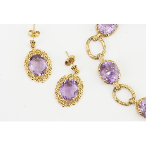 265 - A 9ct gold amethyst set bracelet, along with a matching pair of amethyst and gold earrings. Amethyst... 