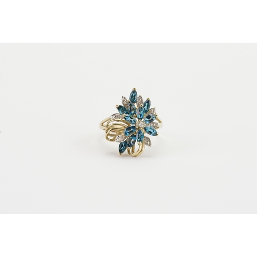 210 - A 9ct gold chip diamond and blue stone set ring, in the floral design. Weight 4.4g.