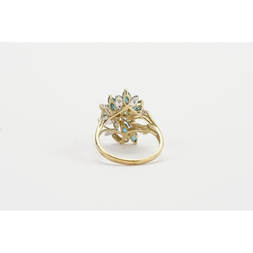 210 - A 9ct gold chip diamond and blue stone set ring, in the floral design. Weight 4.4g.