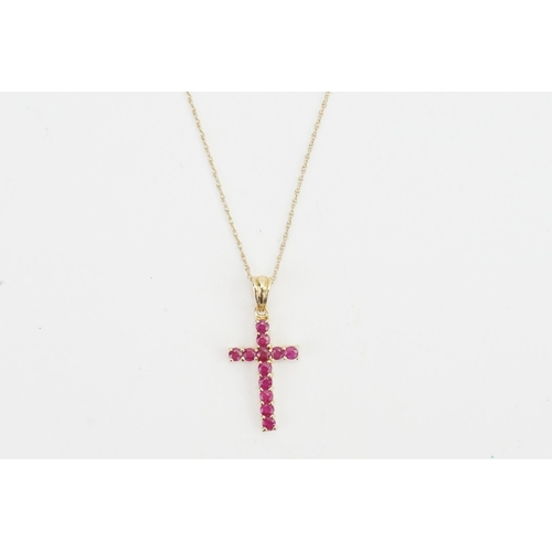 207 - A 9ct gold pink stone set cross, hung on a 9ct gold chain. Weight 1.3g.