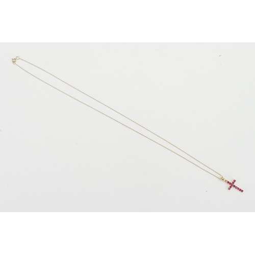 207 - A 9ct gold pink stone set cross, hung on a 9ct gold chain. Weight 1.3g.